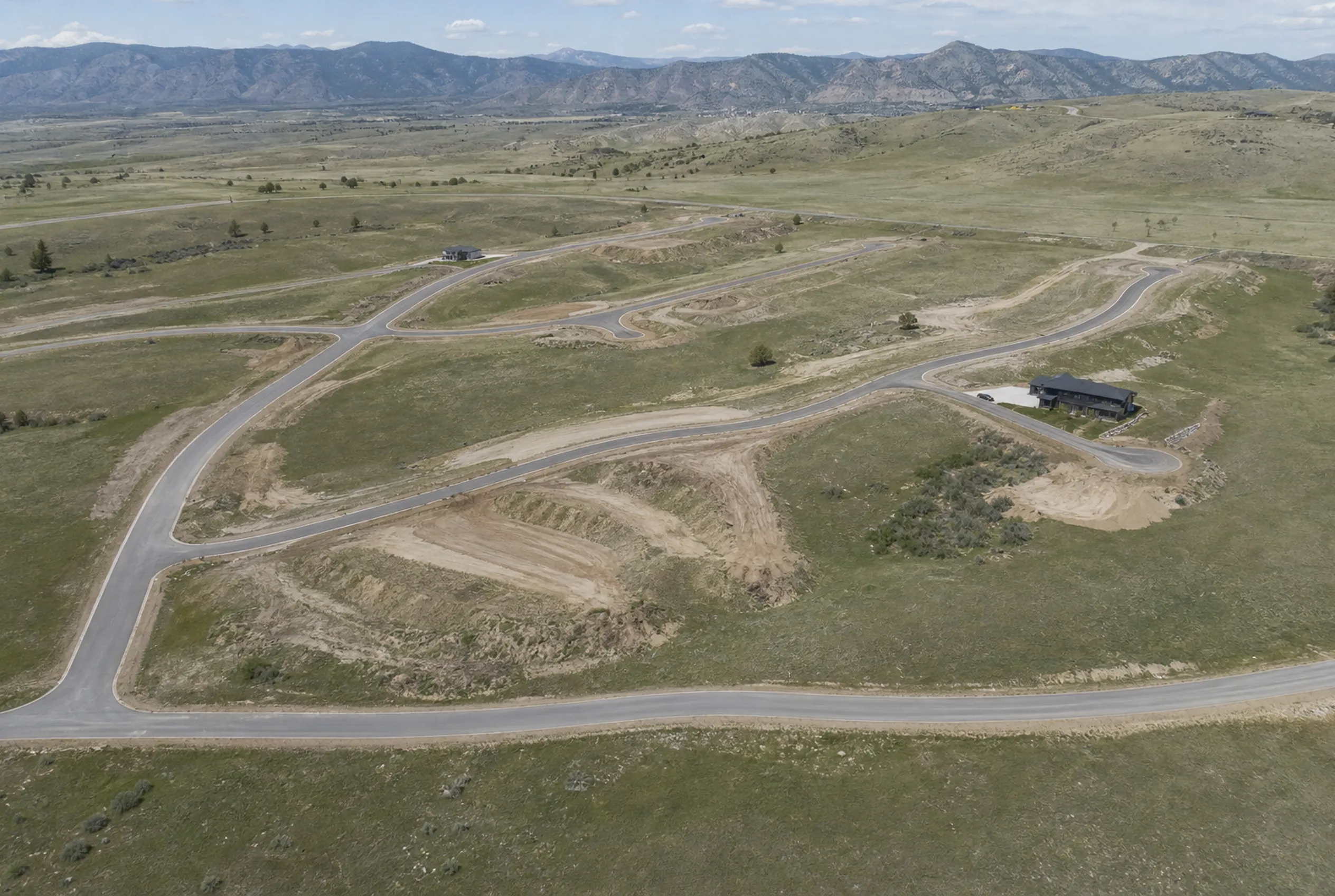 Master-planned residential development in the Colorado foothills, roads and building pads graded in